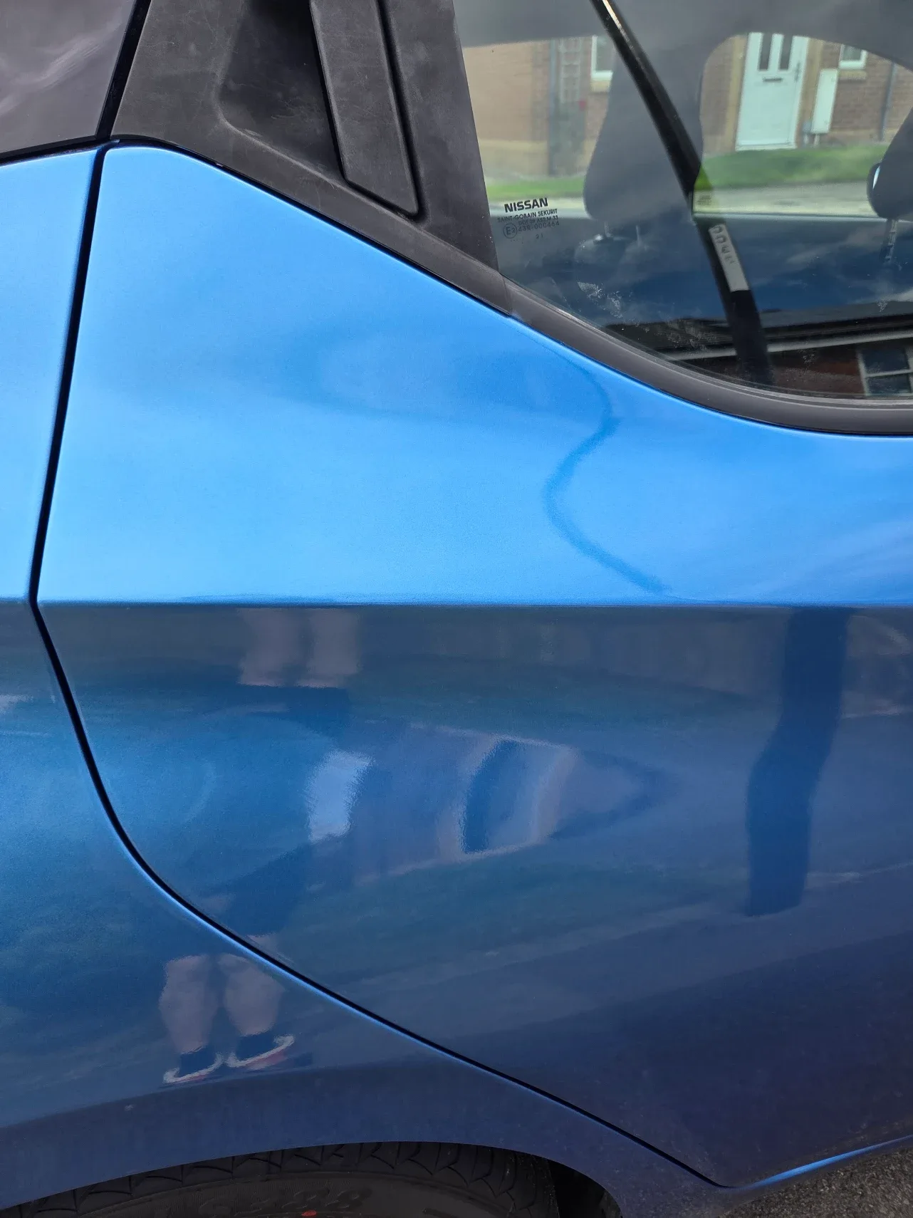 After: blue car door with paint damage, then fully repaired